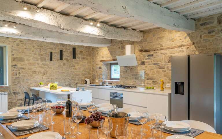 fully equipped kitchen with dining table 